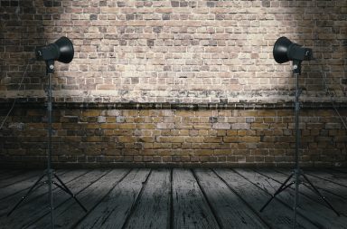 an improvised photo studio brick wall backdrop
