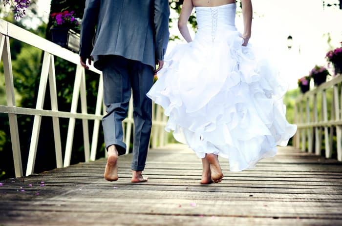 barefoot wedding couple walking