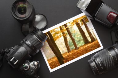 stock photography with camera and lenses around it