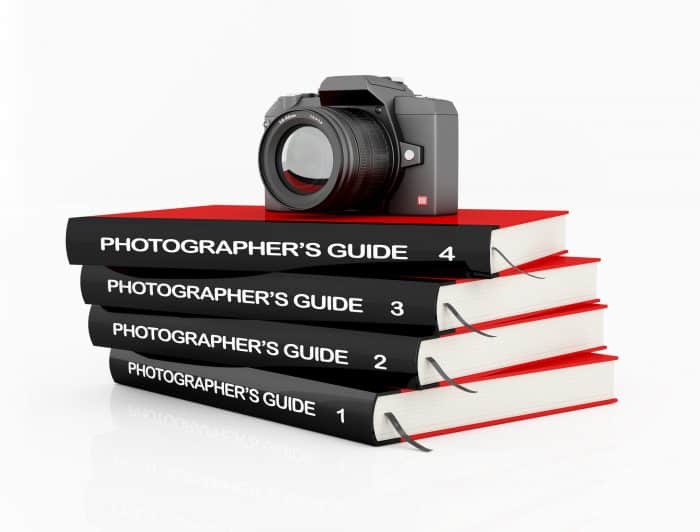 online photography guide book stack and camera