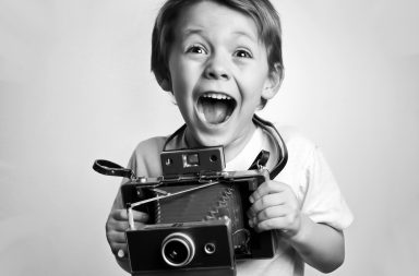 excited kid photographer